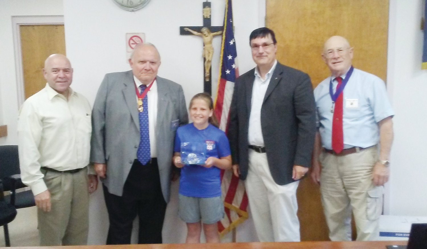 Knights award local soccer star: Mia Hanson, 12, of Bristol has been named an International Champion of the 2018-2019 International Soccer Challenge sponsored by the Knights of Columbus. Hanson was sponsored by Council 379. Her precision penalty shooting placed her in the top one percentile of almost 8,000 participants in the council, district, regional and state levels of competition. Pictured from left, Tony Teixeira, Council 379 soccer coordinator; Michael Dziok, R.I. State Deputy Grand Knight; Hanson, Michael Guerrero state youth soccer director and Walter Smith Council 379 Grand Knight.